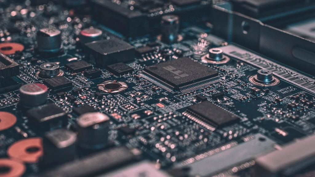 Close-up of a circuit board with chips, capacitors and memory components