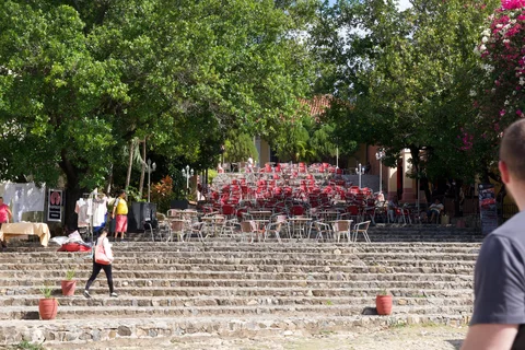 Rows of red and brown chairs on the stone steps outside Casa de la Música in Trinidad