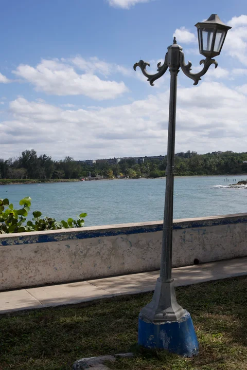 An ornate streetlamp beside the waterfront in Cojímar