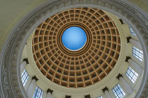 Looking up into the Capitol’s circular dome, with gilded coffers surrounding a blue centre
