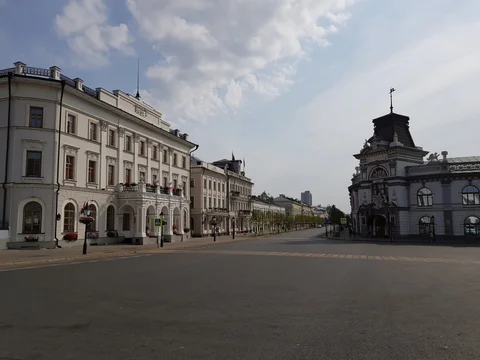 A quiet intersection in central Kazan, lined with pale stone buildings.