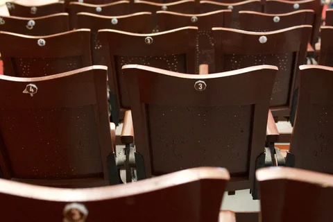 Rows of numbered wooden seats inside Teatro Tomás Terry in Cienfuegos