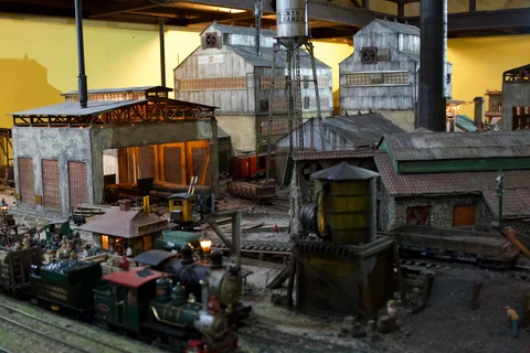Miniature factory buildings, trains and railway tracks in the sugar mill diorama at Havana Club