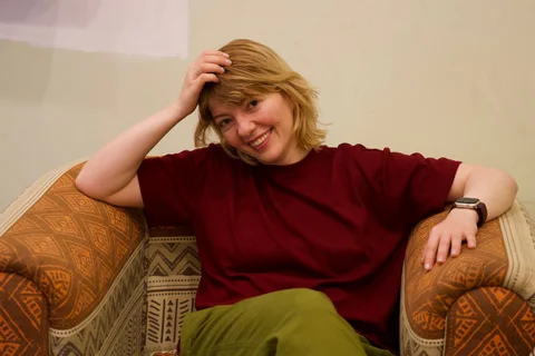 Lena, my beautiful wife, smiling in an armchair at Hotel Ambos Mundos